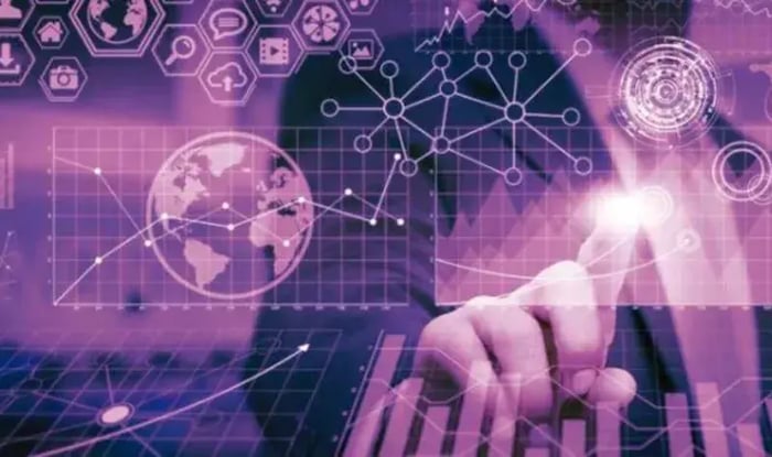 Person interacting with digital dashboards, data charts, and global network visuals.