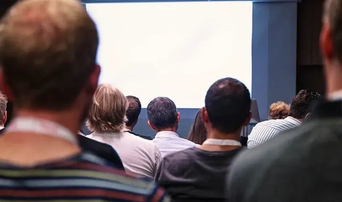 Audience attending a presentation or knowledge-sharing session.