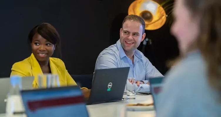 colleagues discussing during session