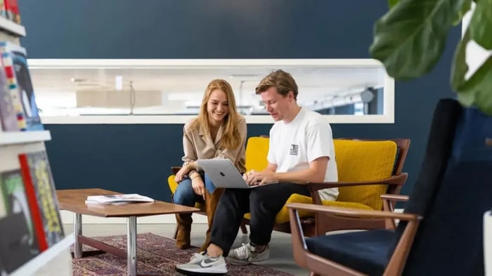Man and woman working with a laptop