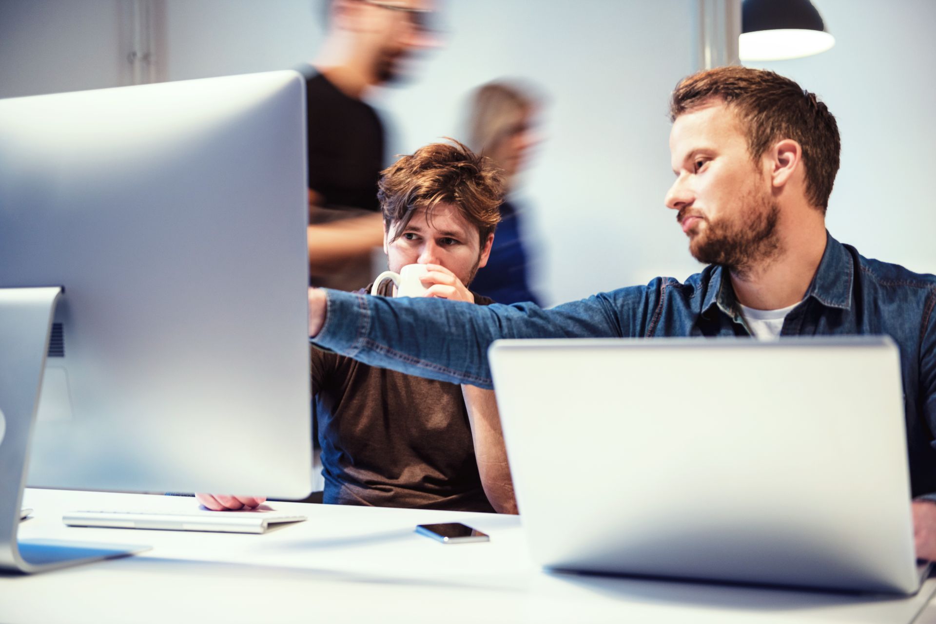 man pointing at screen 