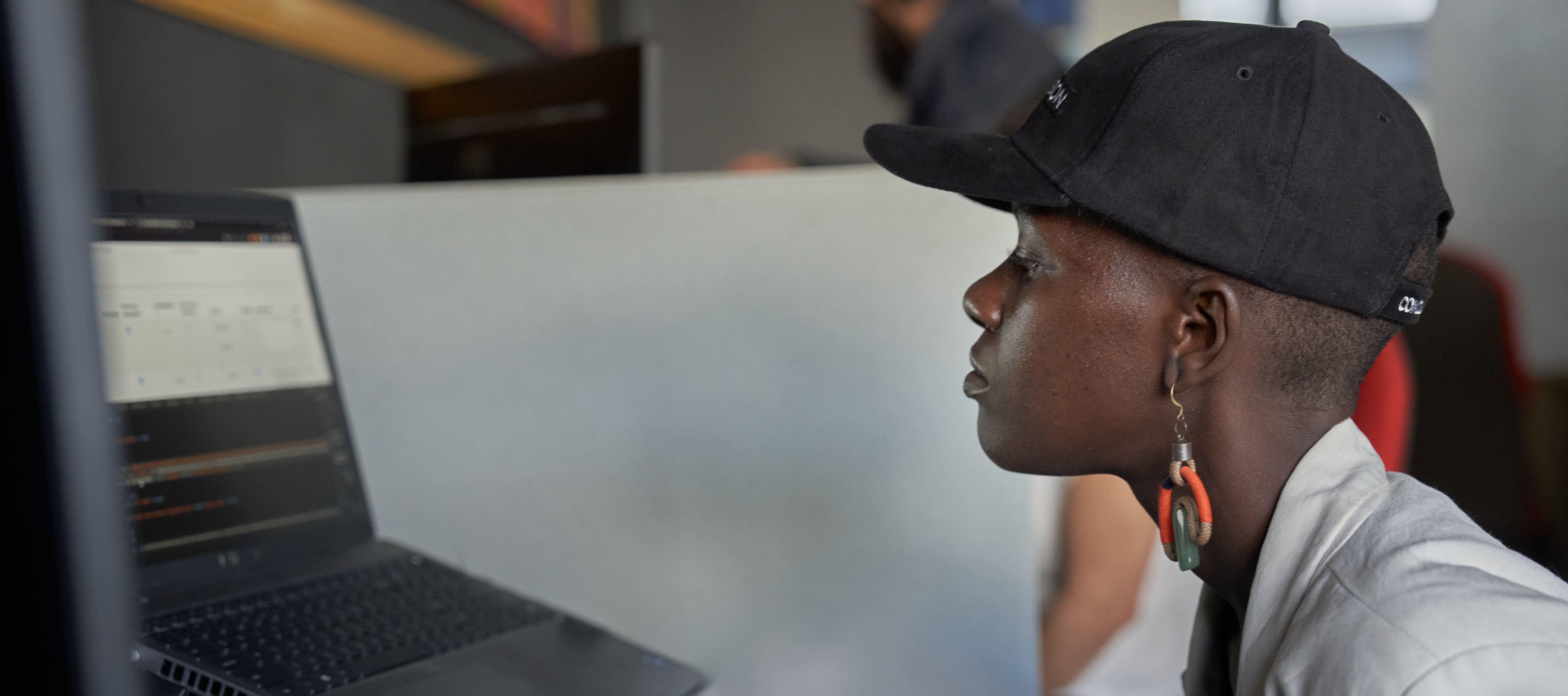 Woman is working and looking at her laptop.