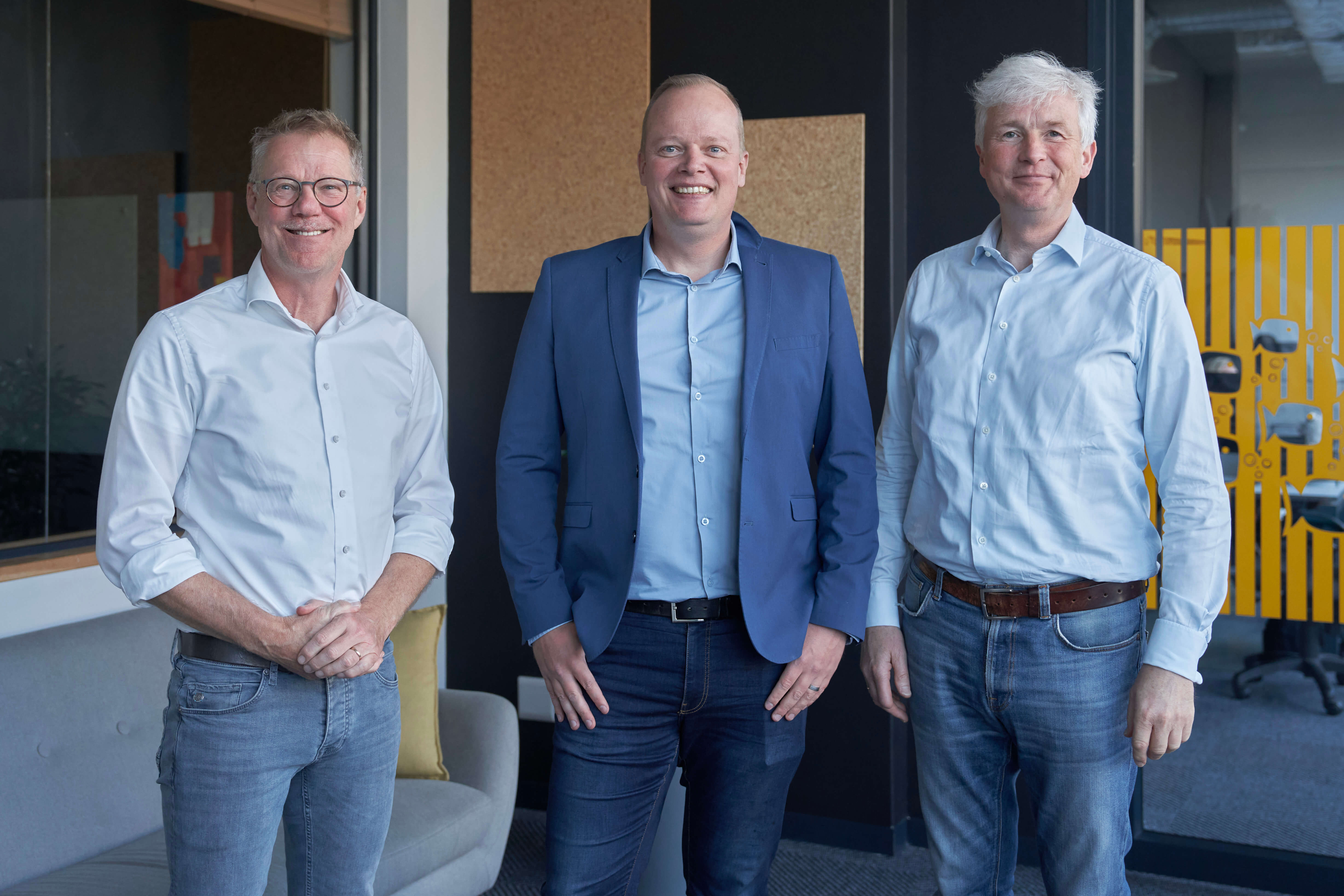 THree men enjoying life and the camera